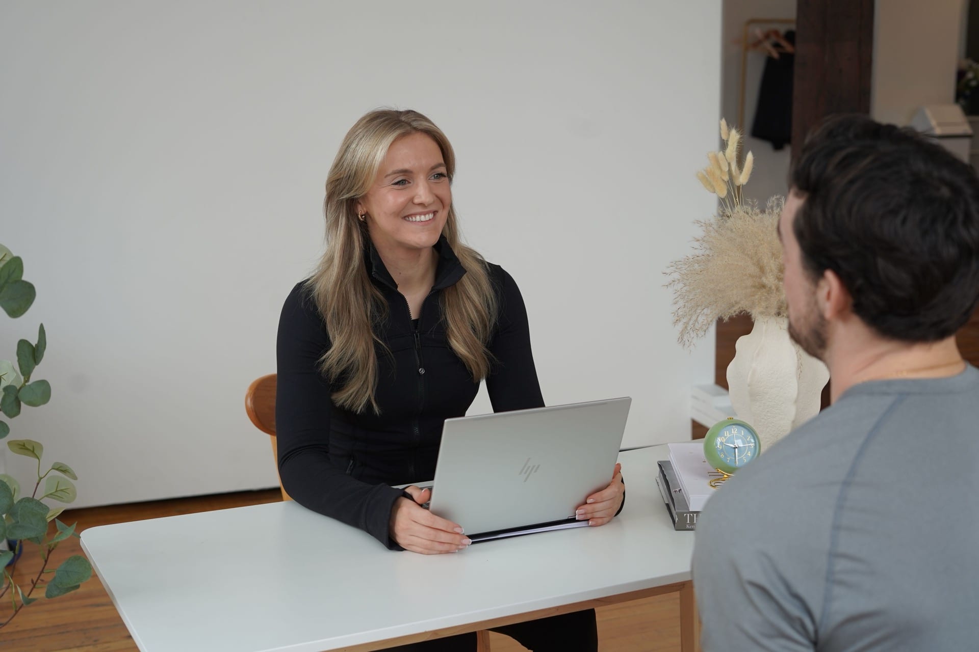 Sam smiling during a consultation.